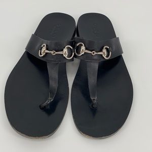 Gucci black leather flip flops